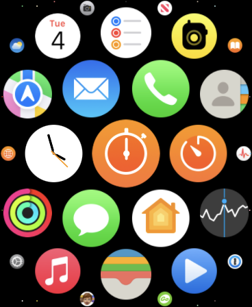 The Grid View screen on Apple Watch, with the Stopwatch and Timer apps in the centre, both orange circles with white clock-style icons.